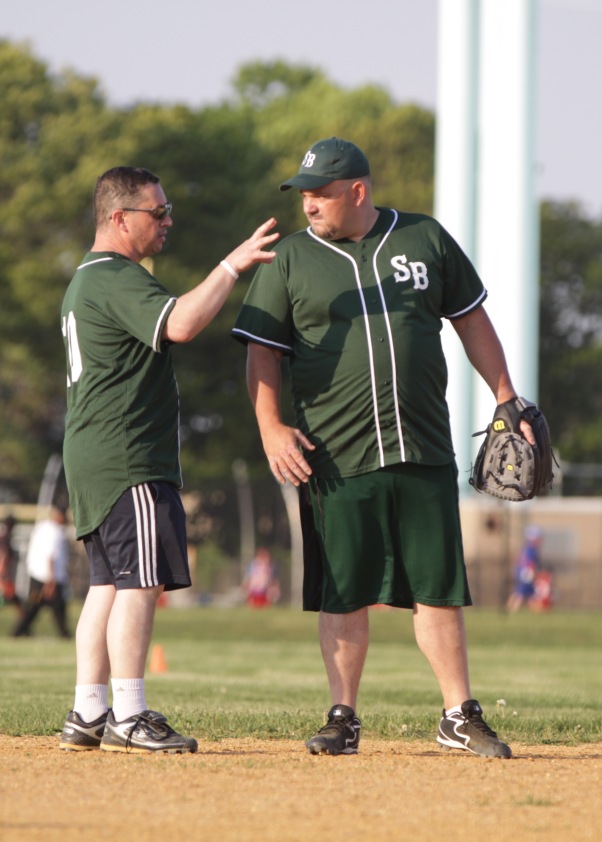 As the manager of St. Bridget's softball team, Jim Cosgrove gives some advice to our first baseman and Field Agent George Hayes.